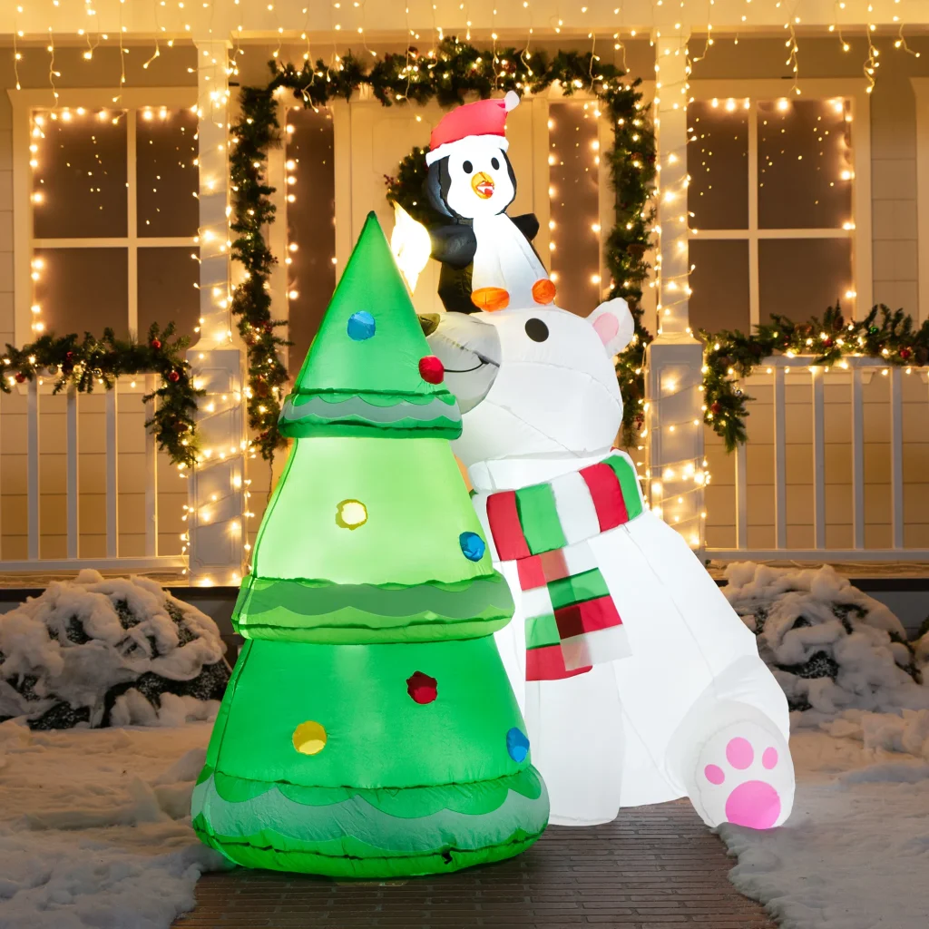 Polar bear blow up christmas tree with penguin