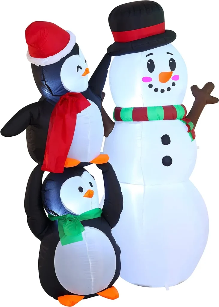 Two christmas penguin inflatable and one snowman