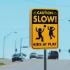 Slow Down Kids Playing Reflective Signs