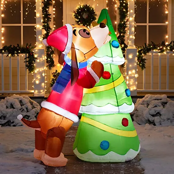 Puppy inflatable putting a tree topper