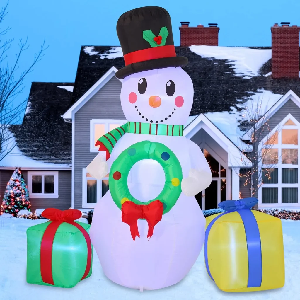 Inflatable snowman holding a christmas wreath