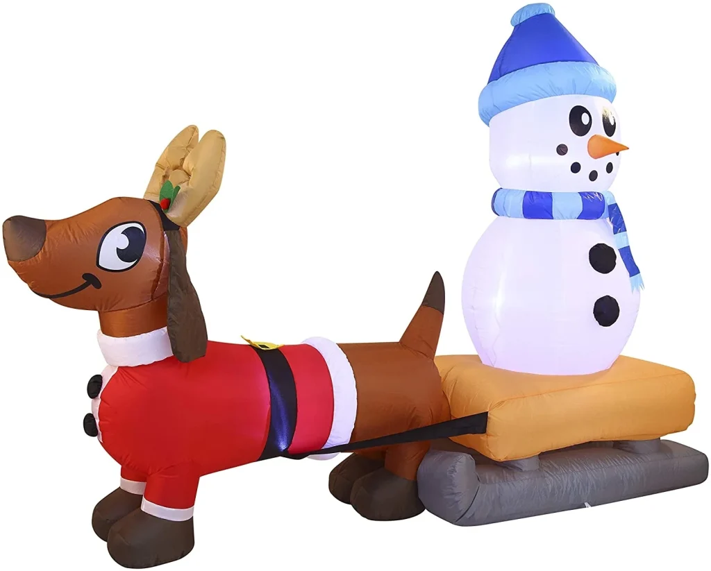 Weiner dog dragging snowman