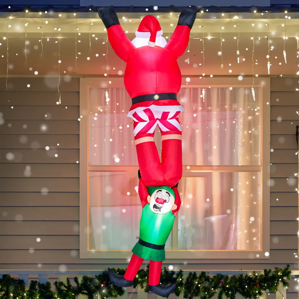 Climbing Santa with Falling Elf Inflatable Decoration