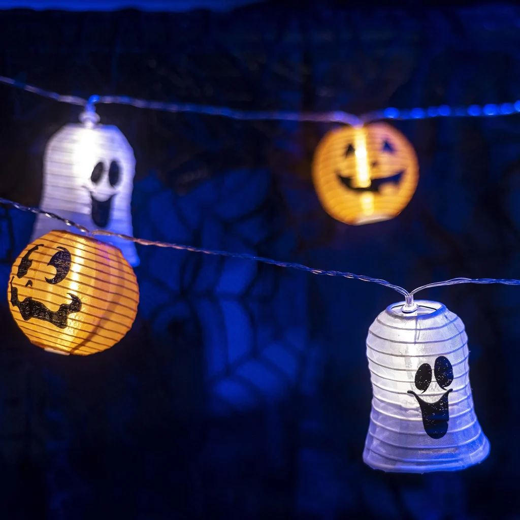 Smiling pumpkin and ghost lantern string lights