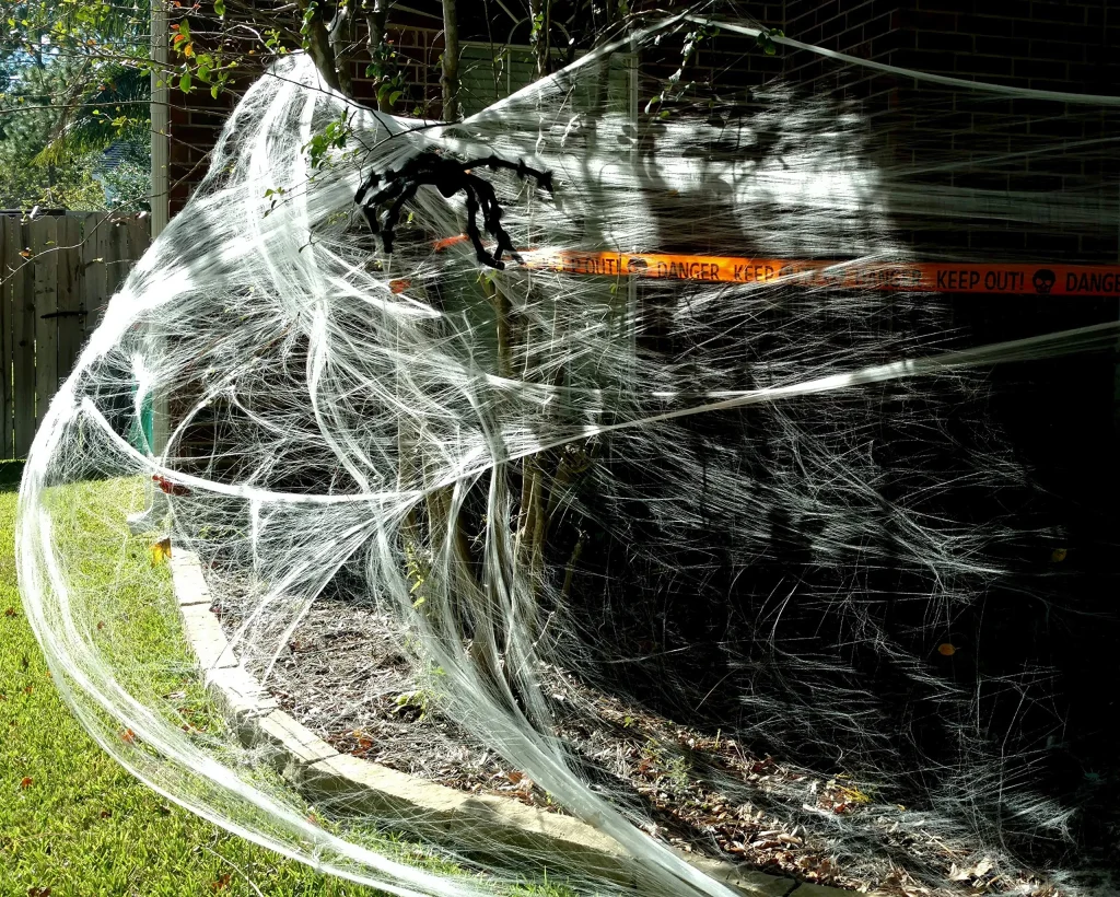 Stretch spider web and plastic spiders