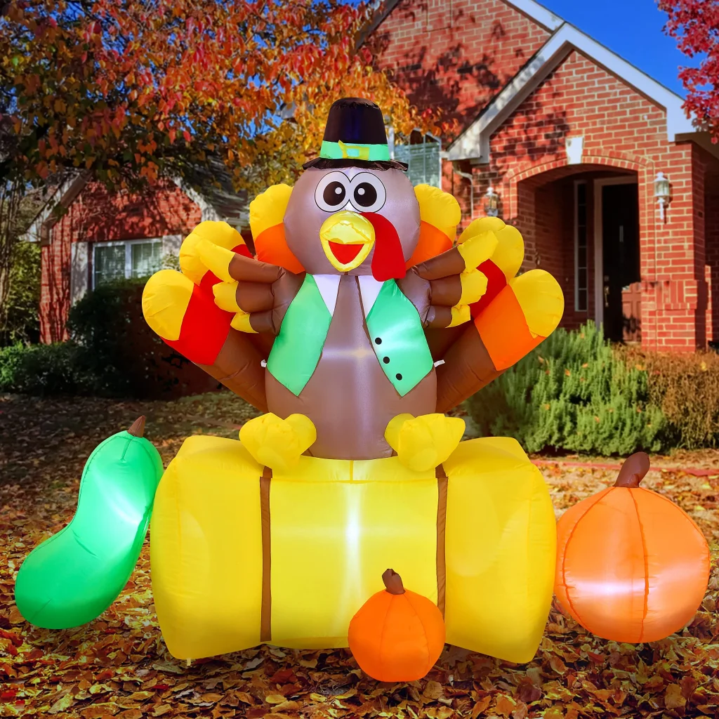Inflatable Turkey Decoration Sitting on a Straw Bale